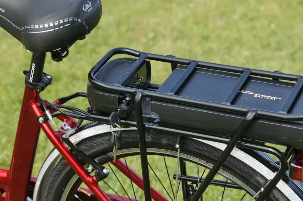 Close-up of an e-bike battery being charged — e-bike battery guide range and lifespan
