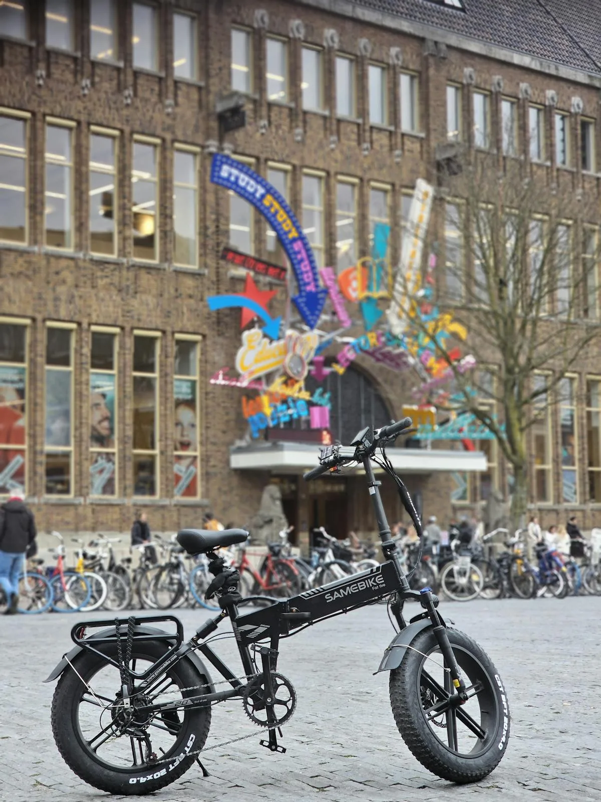 Folding e-bike commuter at a train station