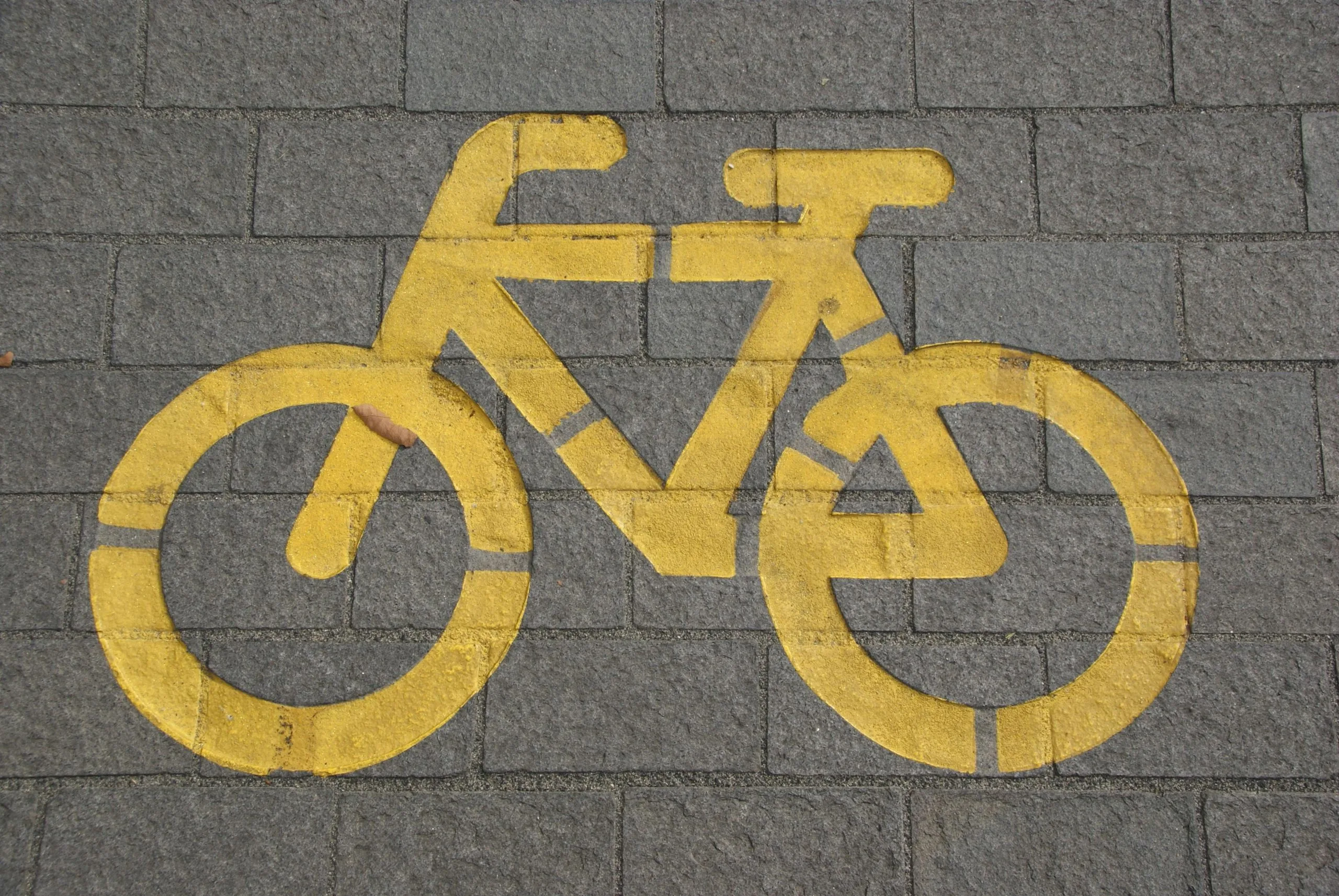 Bicycle lane symbol painted on pavement