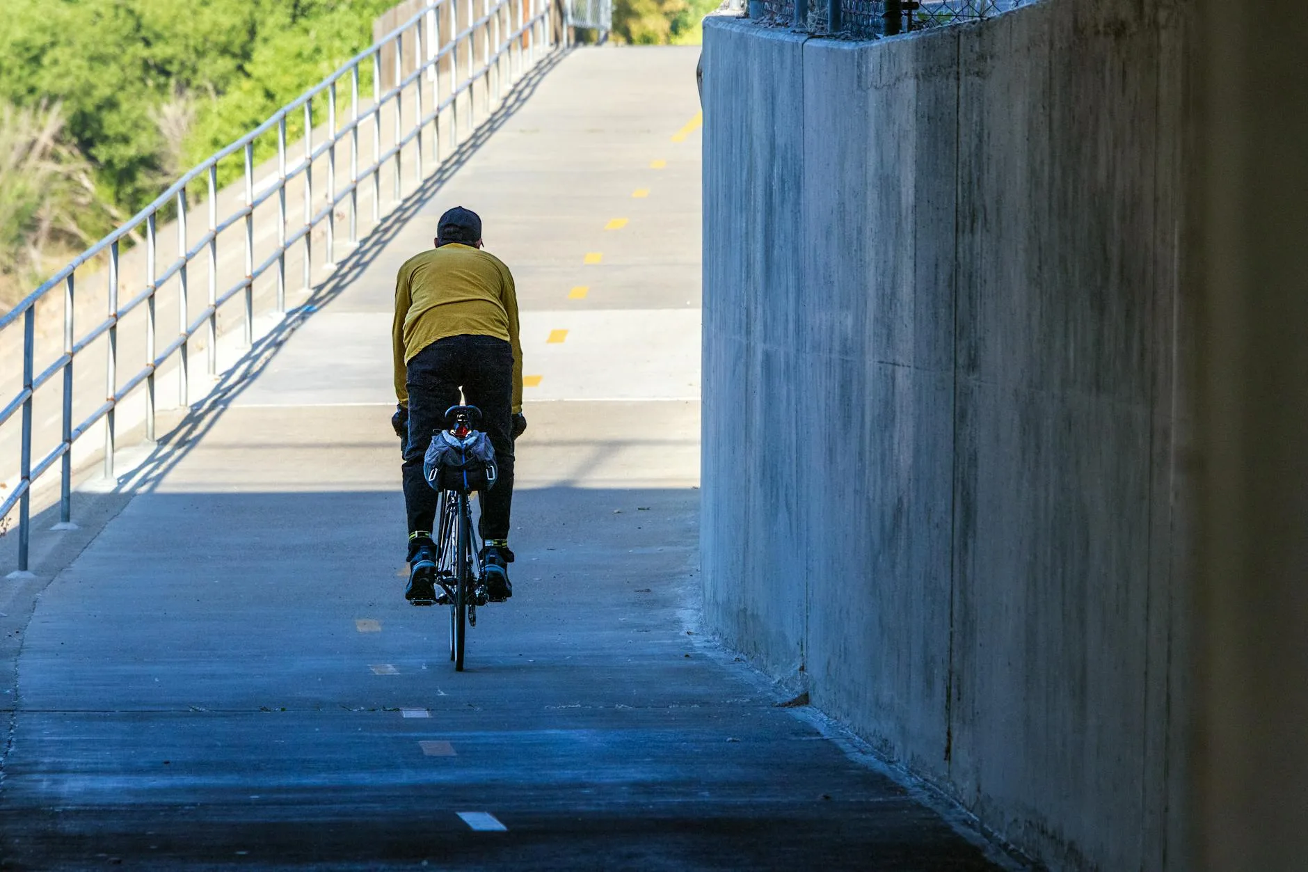 Cyclist on a bike path during a morning commute