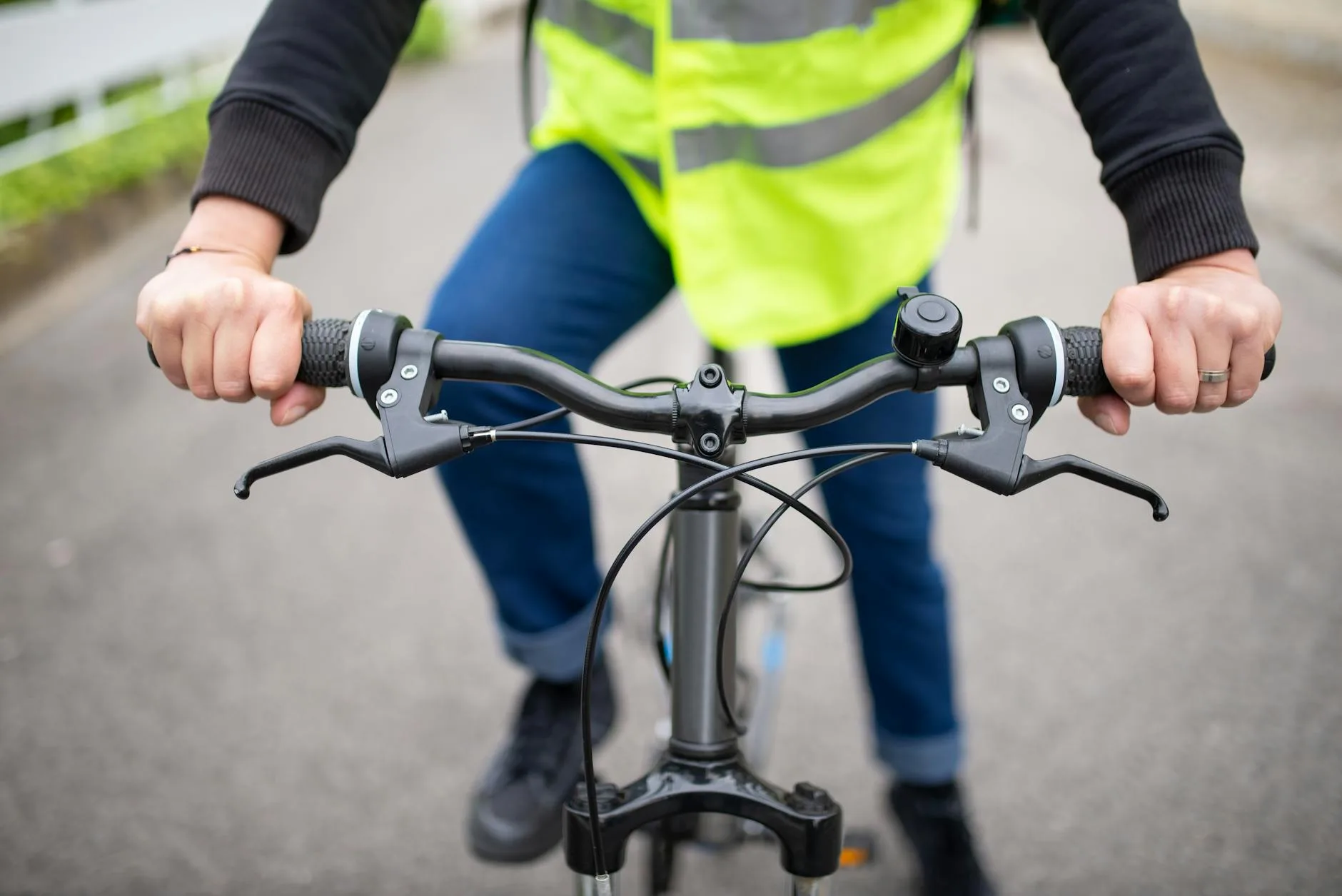 Cyclist looking behind to check for traffic on a road