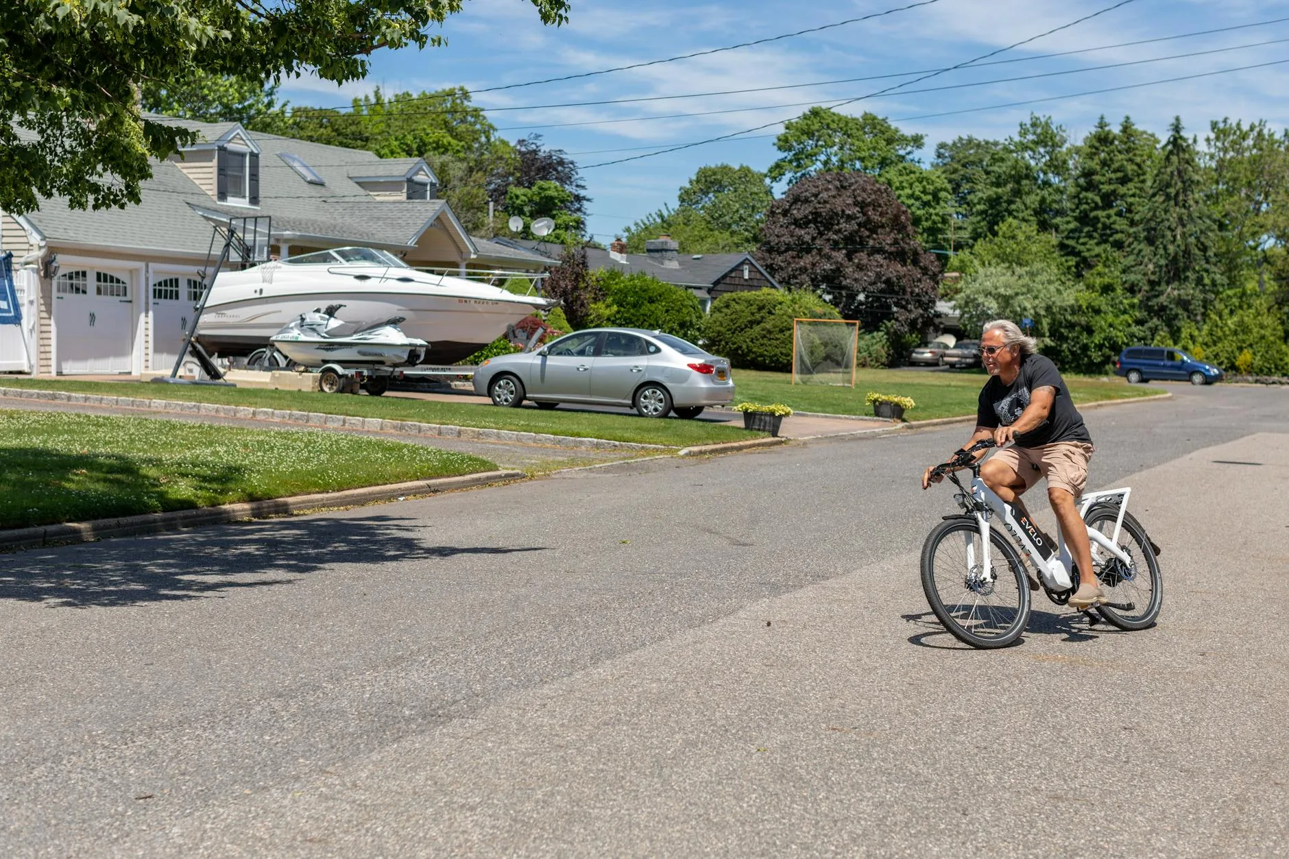 Cyclist riding an electric bike on a commuter road