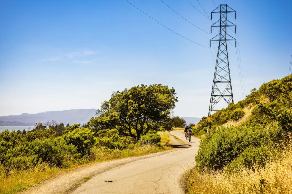 Electric bike being ridden up a steep hill on a rural road