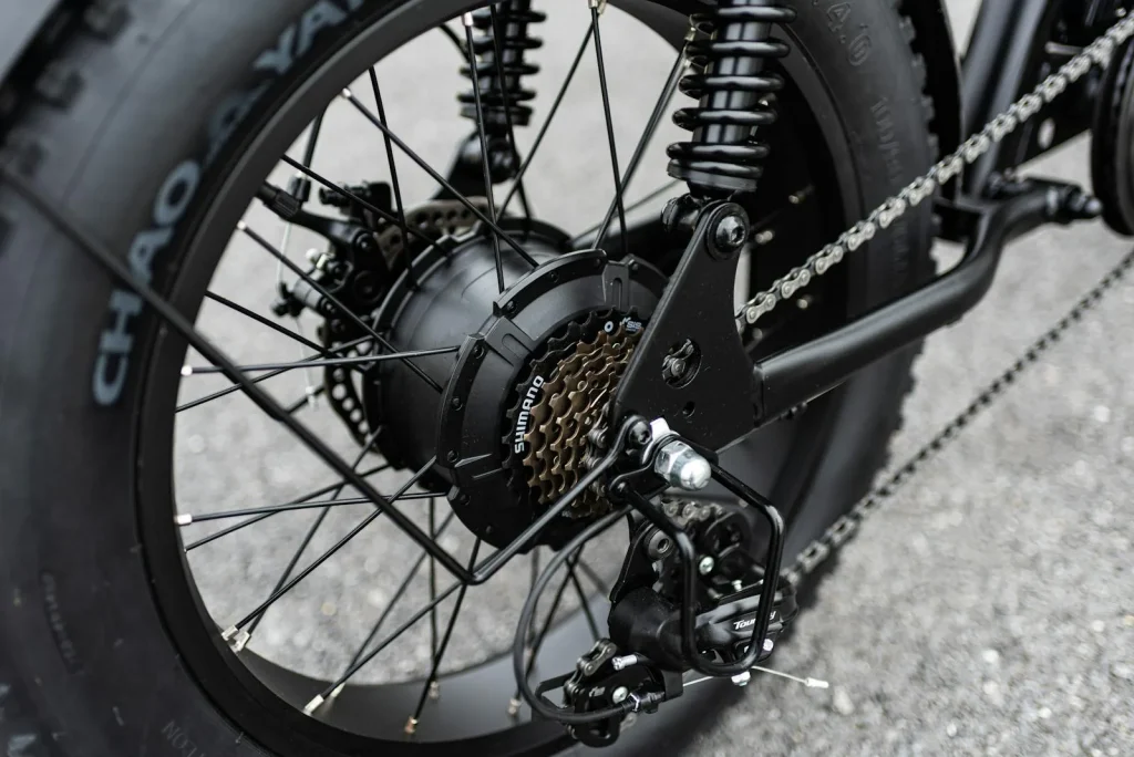 Close-up of an electric bike rear hub motor and drivetrain gears