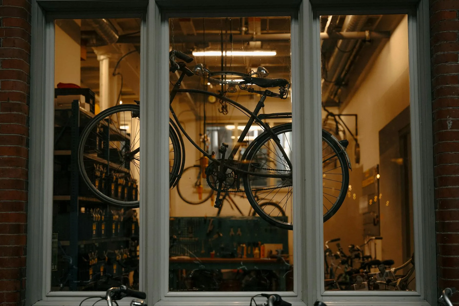 Bicycle mechanic servicing an e-bike in a workshop