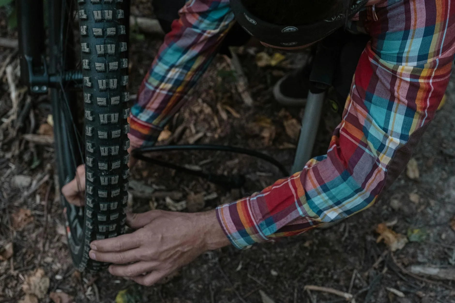 Bicycle tyre and wheel being maintained at a repair station