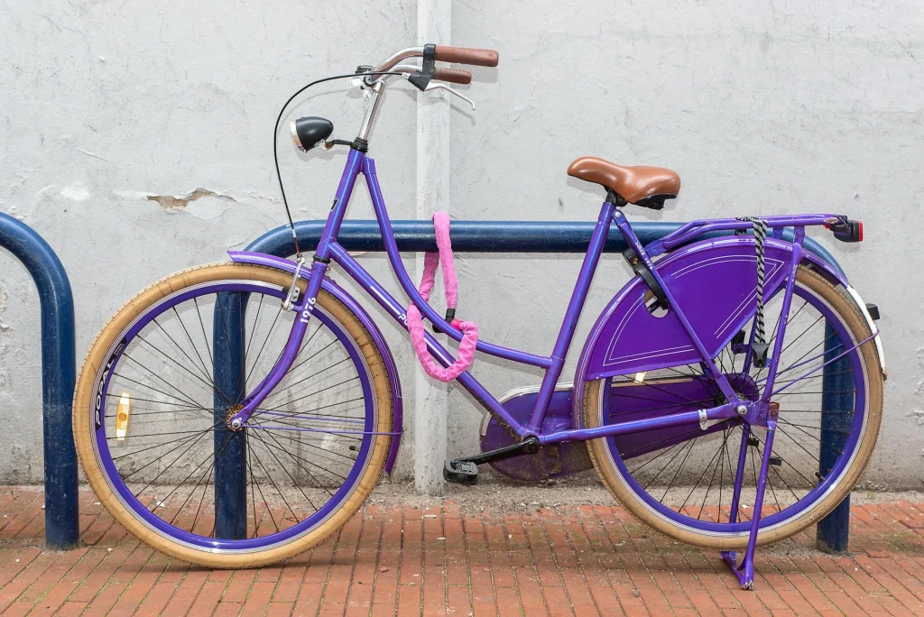 Electric bike locked to a bicycle rack in an urban setting