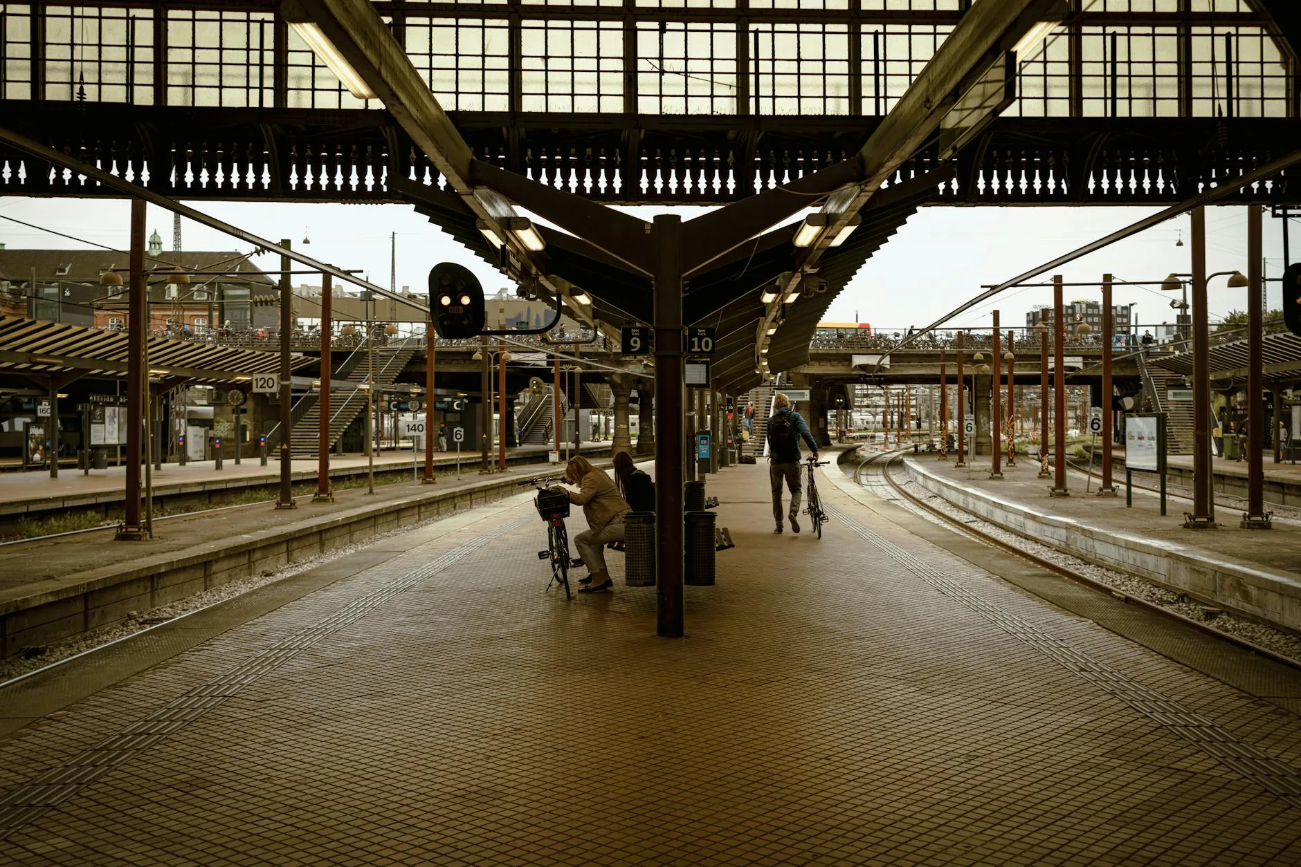 Folded electric bike being carried at a train station