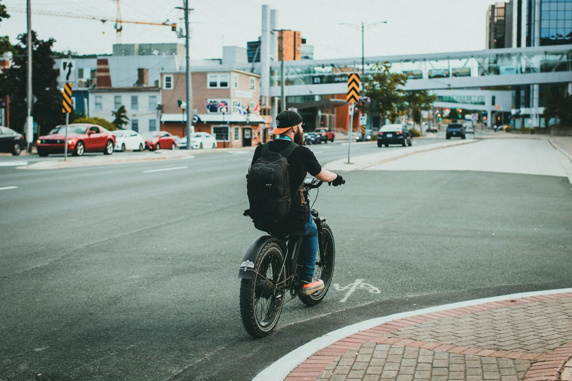 Person riding an electric bike on a city commute