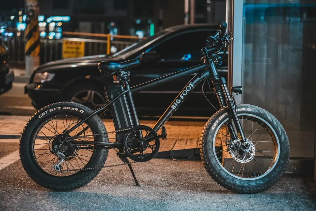 Step-through electric bike parked on a city street