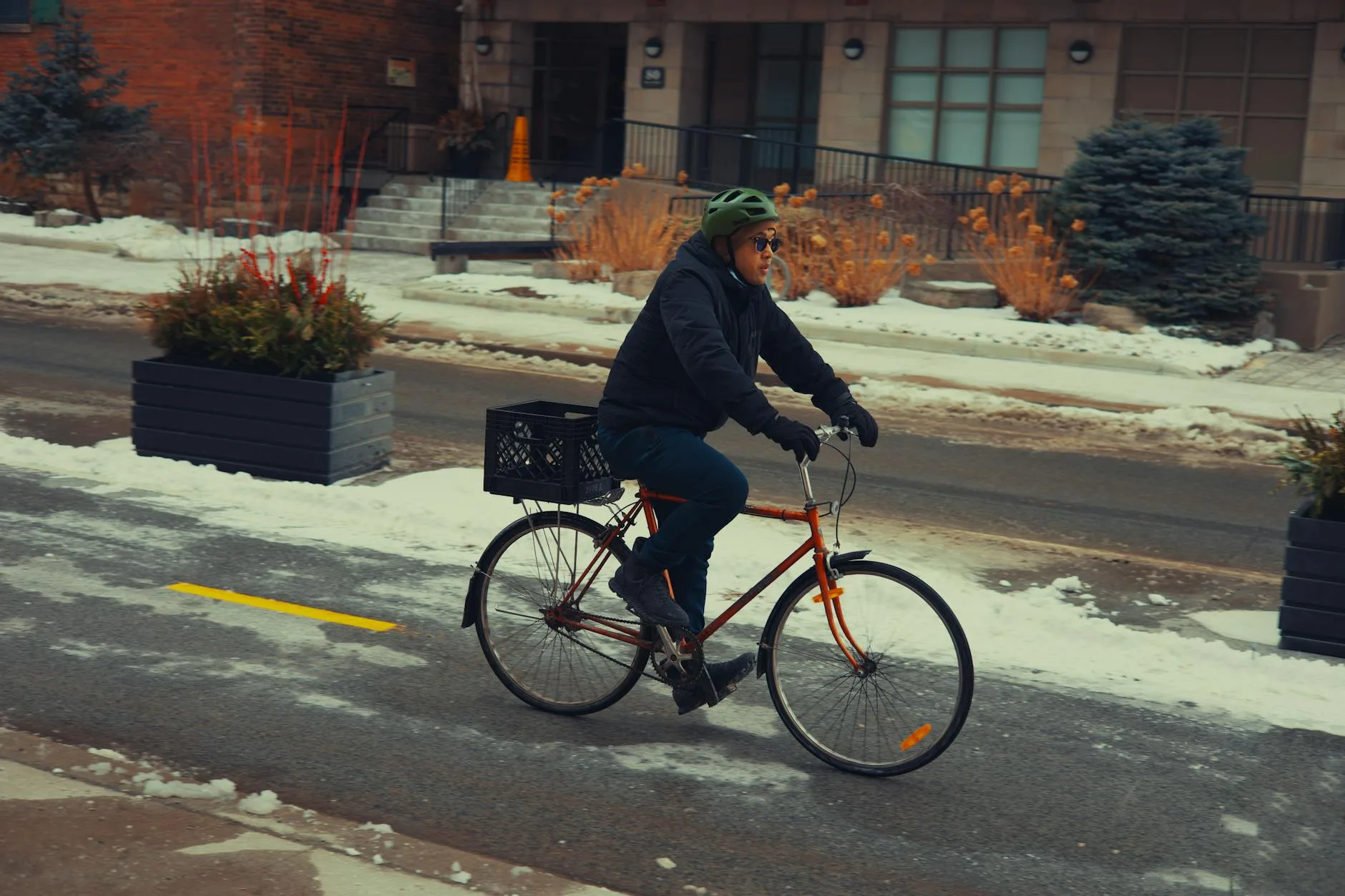 Cyclist commuting on a bicycle on a cold winter morning