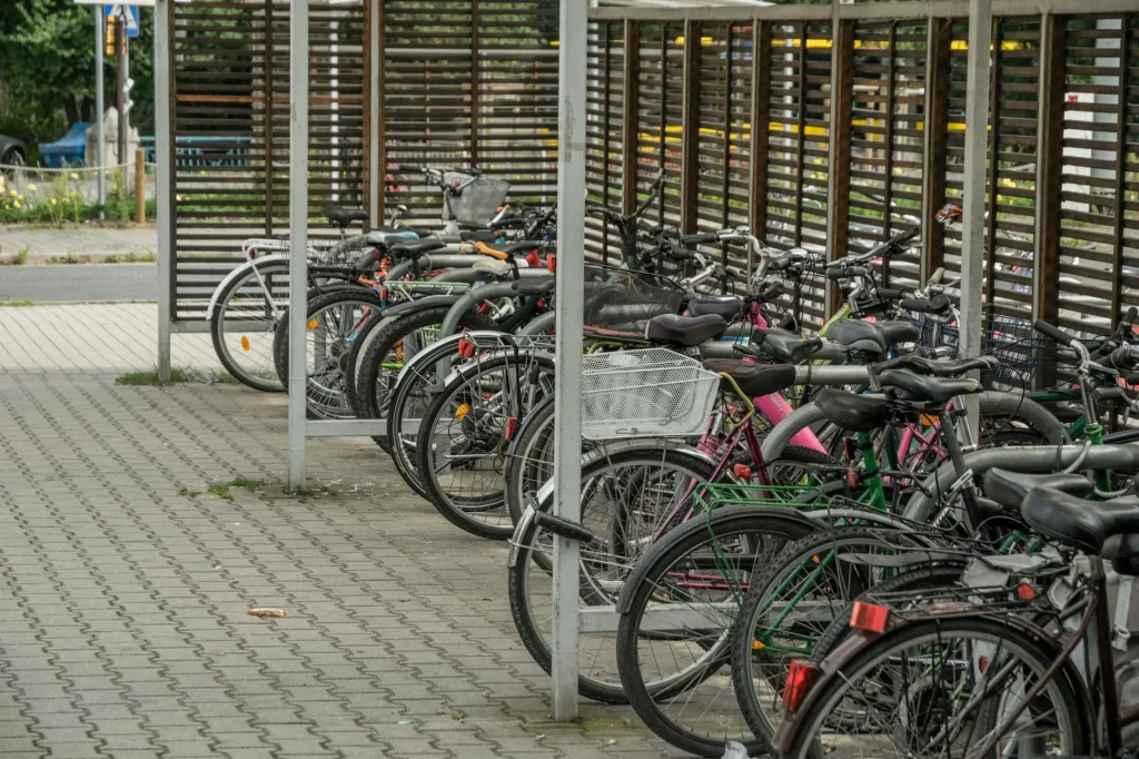 Bicycle parked and locked at a bike rack in a city