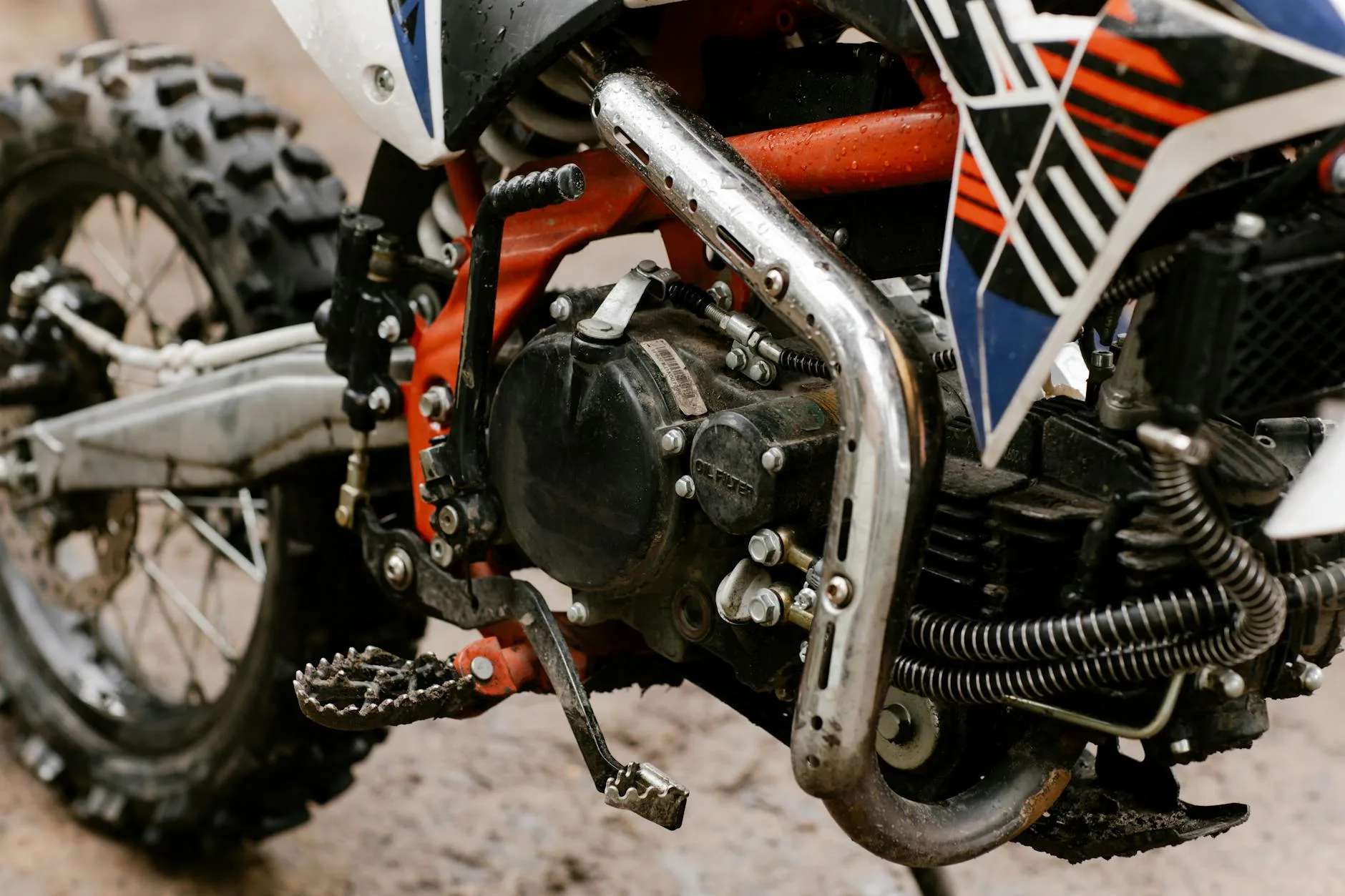 Cleaning a muddy electric mountain bike after a trail ride