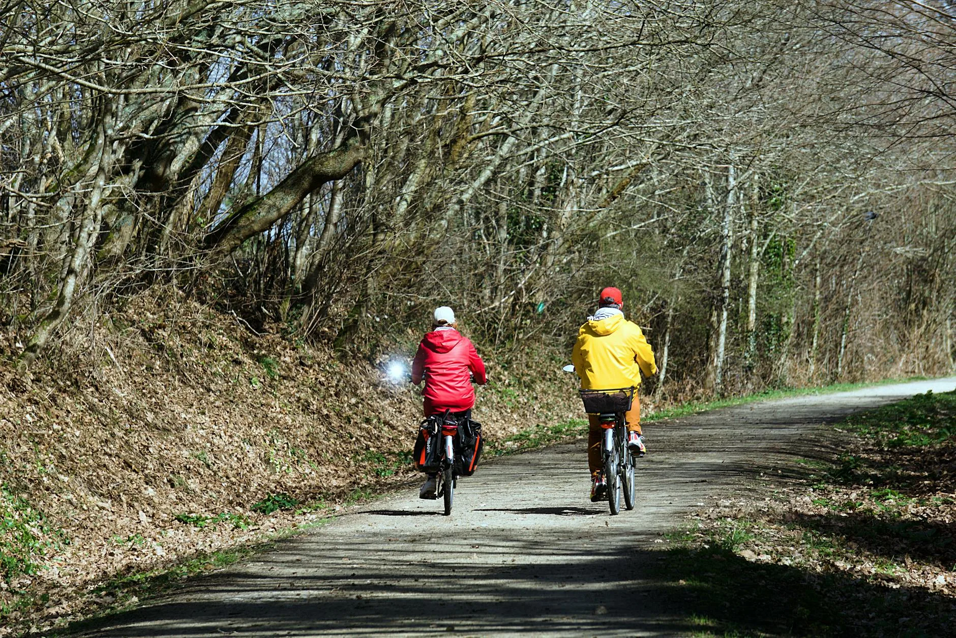 Person cycling an e-bike on countryside path