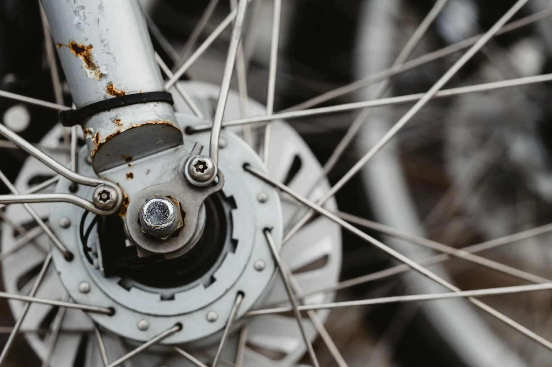 Close-up of a bicycle wheel hub in a repair workshop