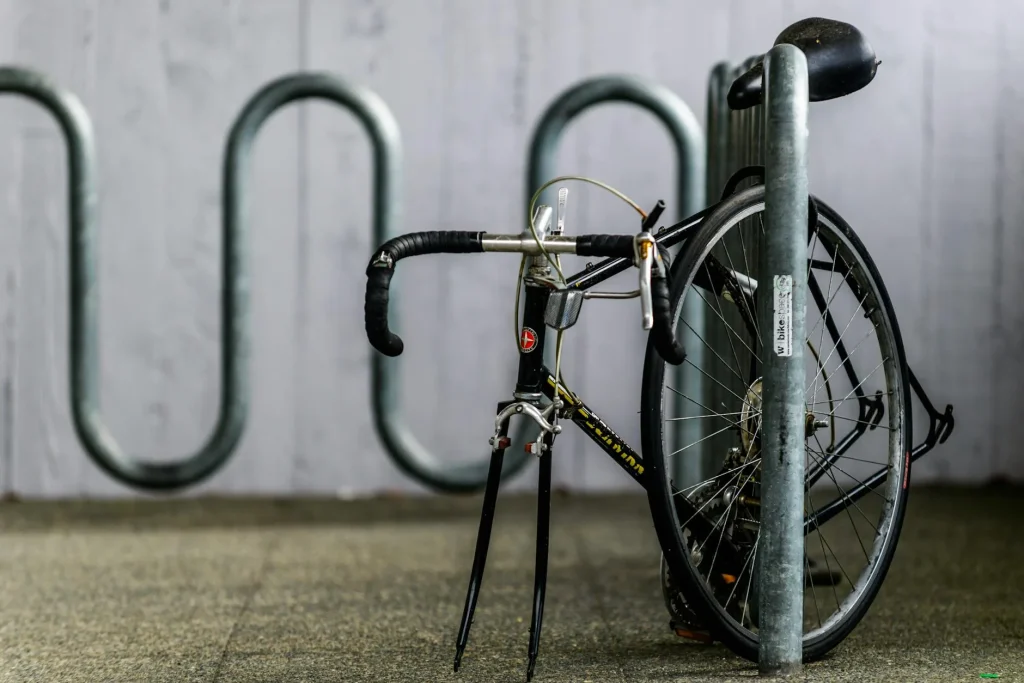 Electric bicycle securely locked to a bike rack