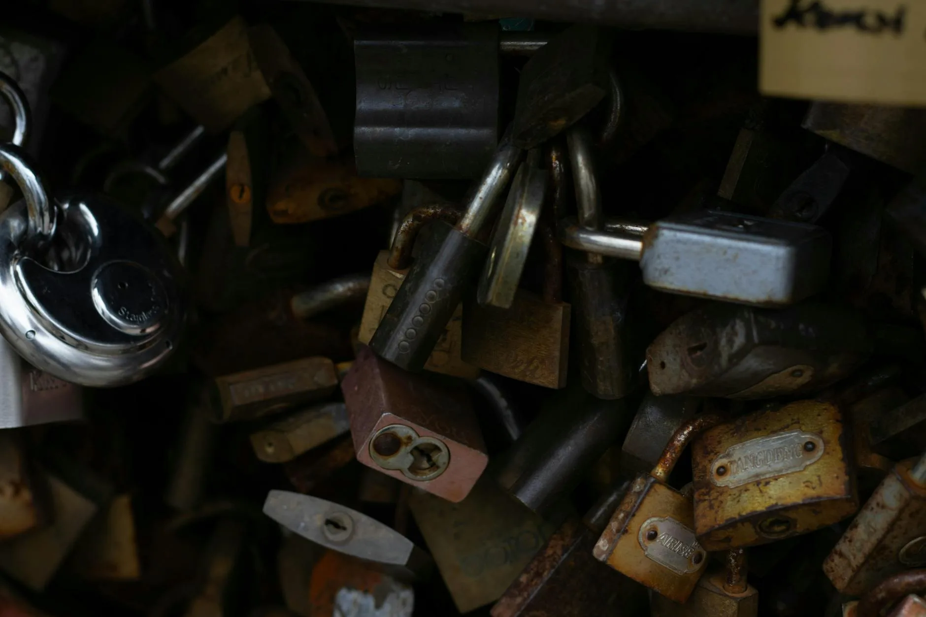 Close-up of steel padlocks showing security mechanisms