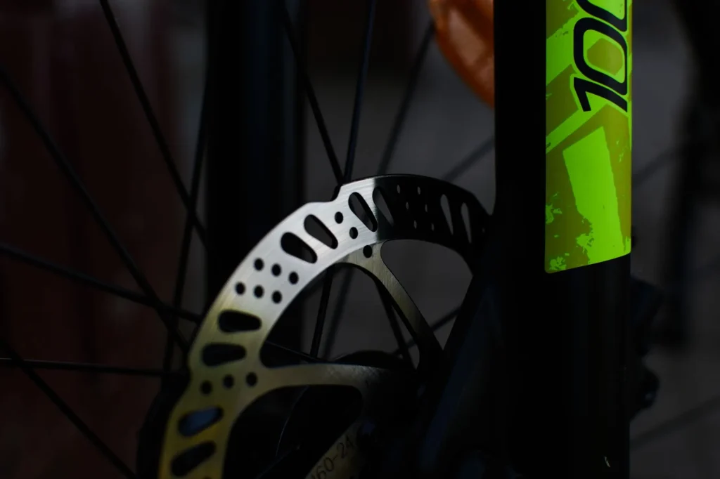 Close-up of an e-bike disc brake rotor on a front wheel