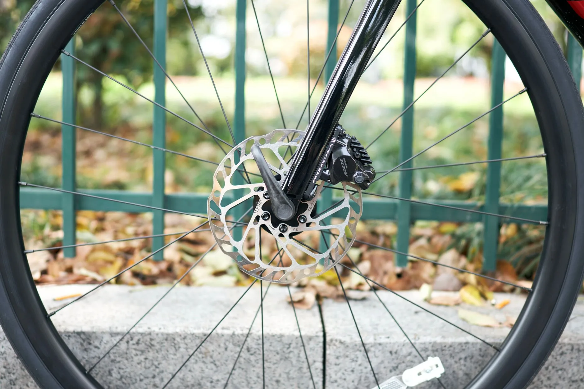 Close-up of e-bike disc brakes and tyre tread before a ride