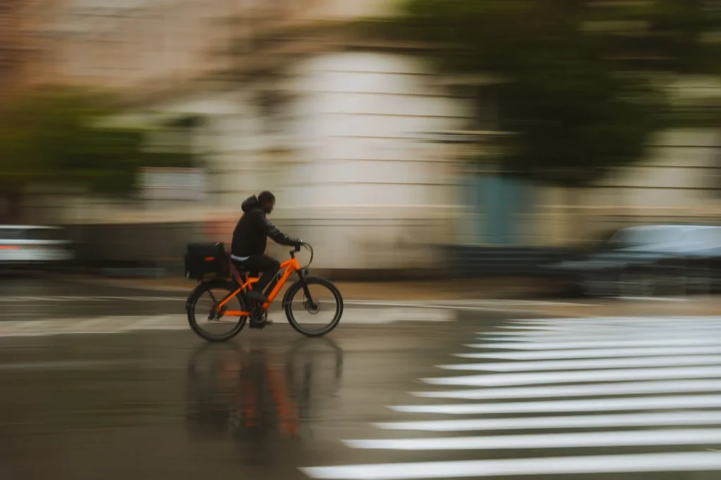 E-bike with full mudguards on a wet road