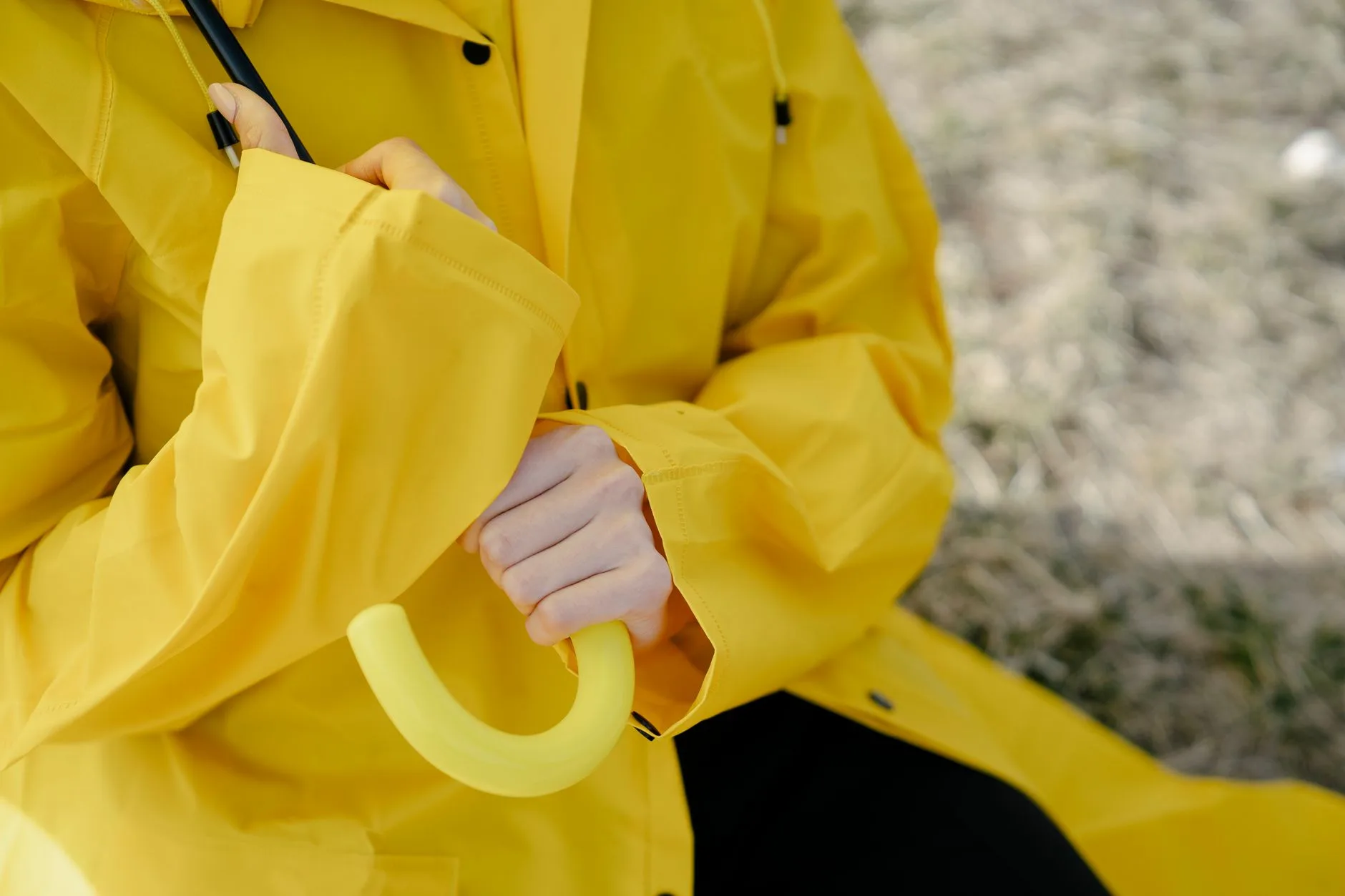 Cyclist wearing a waterproof rain jacket in wet commuting weather